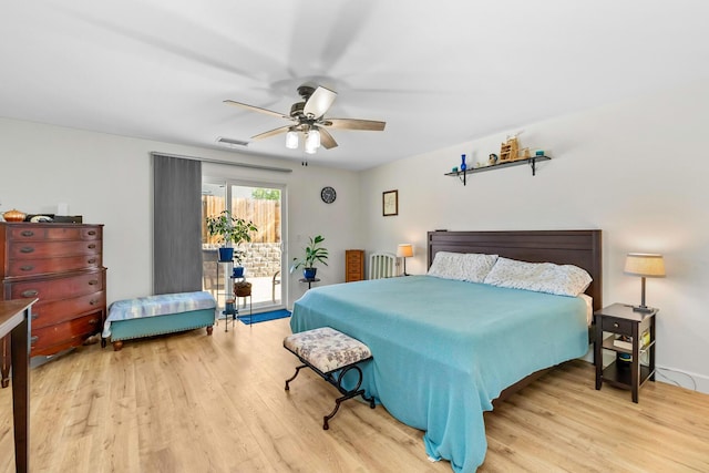 1390 Tule Peak Cir, Carson City, NV 89701 - bedroom with wood finished floors, access to exterior, and ceiling fan