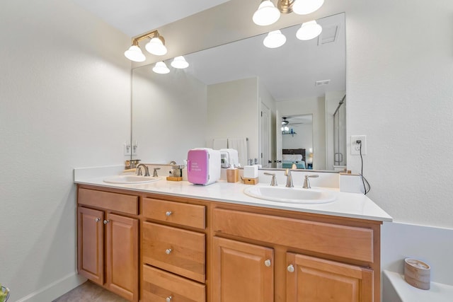 1390 Tule Peak Cir, Carson City, NV 89701 - ensuite bathroom with double vanity and ceiling fan