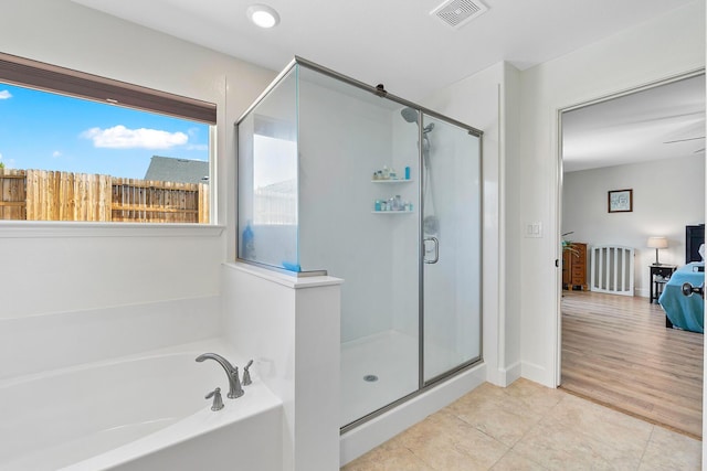 1390 Tule Peak Cir, Carson City, NV 89701 - bathroom featuring a stall shower, a bath, and tile patterned floors