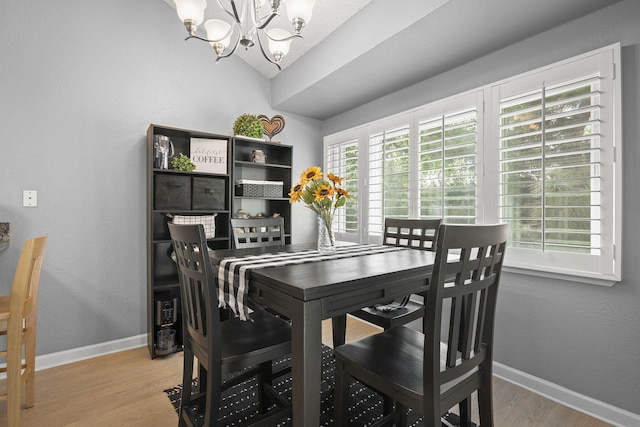 2107 G St, Sparks, NV 89431 - dining area featuring a chandelier, wood finished floors, baseboards, and vaulted ceiling