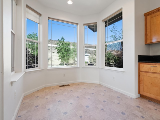 570 Buckskin Dr, Fernley, NV 89408 - unfurnished dining area featuring healthy amount of natural light, baseboards, and recessed lighting