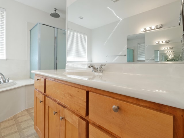 570 Buckskin Dr, Fernley, NV 89408 - bathroom featuring a shower stall, a bath, vanity, and tile patterned floors