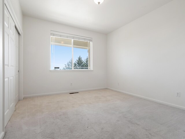 570 Buckskin Dr, Fernley, NV 89408 - unfurnished bedroom with carpet flooring, a closet, and baseboards