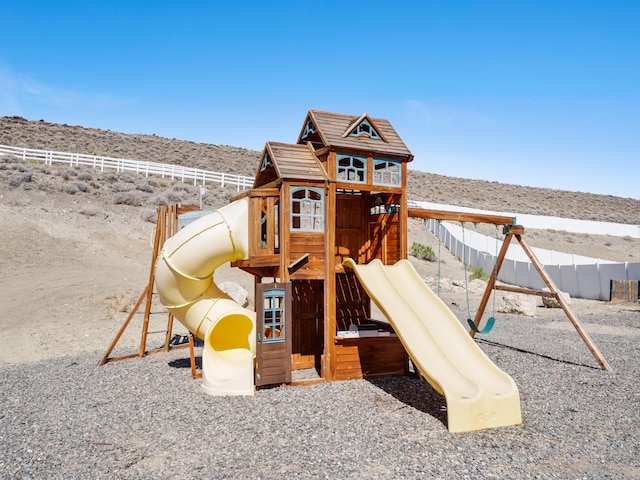 570 Buckskin Dr, Fernley, NV 89408 - view of playground featuring a mountain view and fence