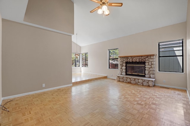 1043 Shenandoah Dr, Carson City, NV 89702 - unfurnished living room with baseboards, high vaulted ceiling, ceiling fan, and a fireplace