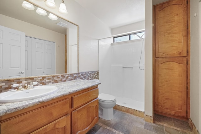 1043 Shenandoah Dr, Carson City, NV 89702 - bathroom with a walk in shower, vanity, and toilet