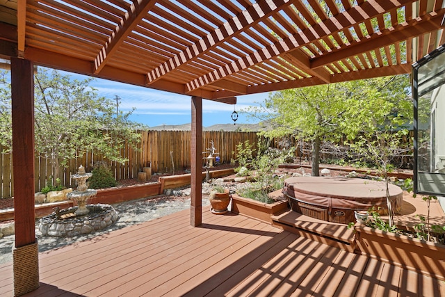 1043 Shenandoah Dr, Carson City, NV 89702 - wooden deck with a covered hot tub, a fenced backyard, and a pergola