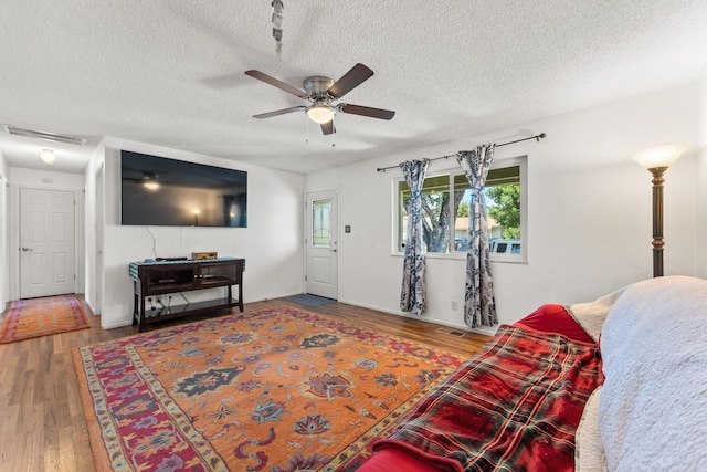 2580 Pequop St, Reno, NV 89512 - living area featuring a ceiling fan, wood finished floors, and a textured ceiling