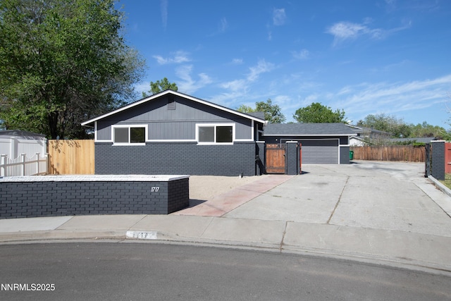1717 Rio Tinto Dr, Sparks, NV 89434 - ranch-style house featuring brick siding, concrete driveway, and a garage