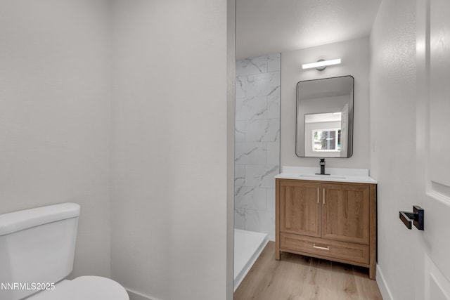 1717 Rio Tinto Dr, Sparks, NV 89434 - full bath featuring a shower, vanity, toilet, wood finished floors, and baseboards