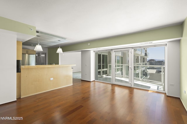 255 N Sierra St Unit 1419, Reno, NV 89501 - unfurnished living room featuring dark wood-style floors