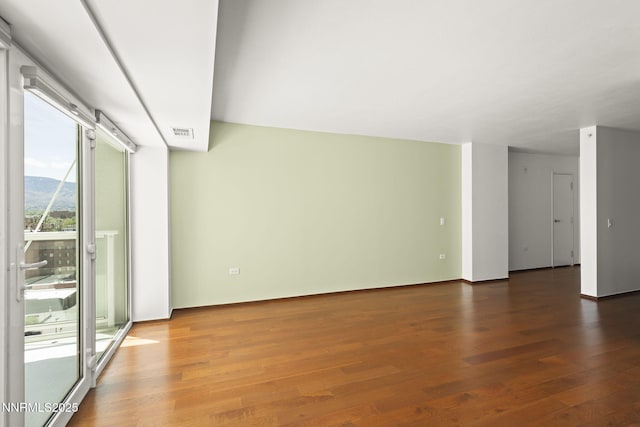 255 N Sierra St Unit 1419, Reno, NV 89501 - spare room featuring wood finished floors and a mountain view