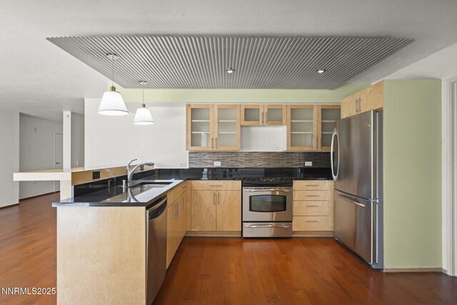 255 N Sierra St Unit 1419, Reno, NV 89501 - kitchen featuring appliances with stainless steel finishes, a peninsula, light brown cabinetry, and glass insert cabinets