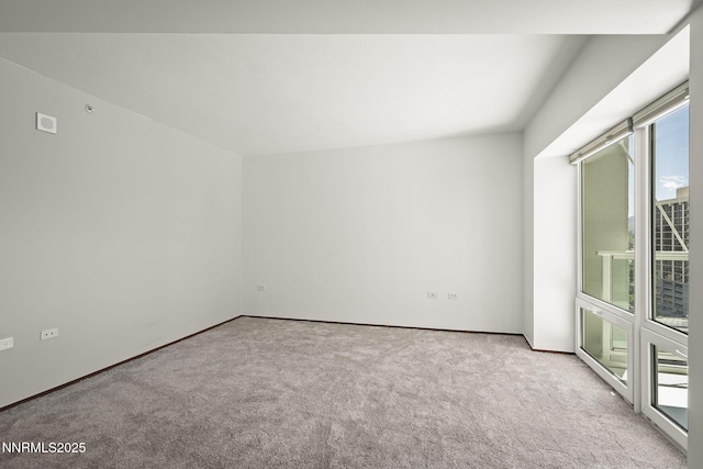 255 N Sierra St Unit 1419, Reno, NV 89501 - empty room with healthy amount of natural light, carpet floors, and baseboards