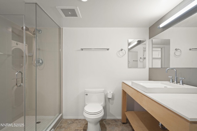 255 N Sierra St Unit 1419, Reno, NV 89501 - full bathroom with baseboards, toilet, vanity, and a shower stall