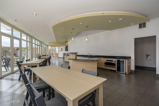 255 N Sierra St Unit 1419, Reno, NV 89501 - dining room with dark tile patterned floors, beverage cooler, recessed lighting, and floor to ceiling windows