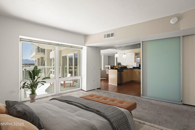 255 N Sierra St Unit 1419, Reno, NV 89501 - bedroom featuring dark carpet, access to exterior, and a sink