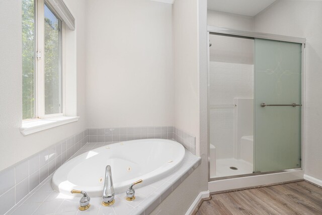 3221 Segura Ct, Sparks, NV 89436 - bathroom featuring wood finished floors, a shower stall, and a whirlpool tub