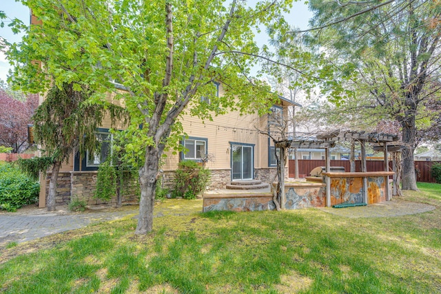 3221 Segura Ct, Sparks, NV 89436 - back of house with a pergola and stone siding