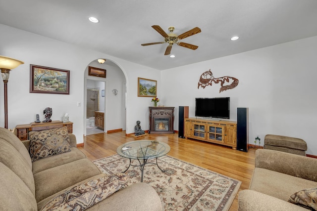 1634 Buzzys Ranch Rd, Carson City, NV 89701 - living room with arched walkways, ceiling fan, light wood-type flooring, recessed lighting, and baseboards