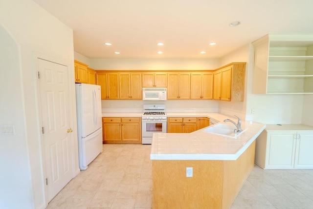 2413 San Remo Dr, Sparks, NV 89434 - kitchen featuring white appliances, a sink, a peninsula, recessed lighting, and light tile patterned floors