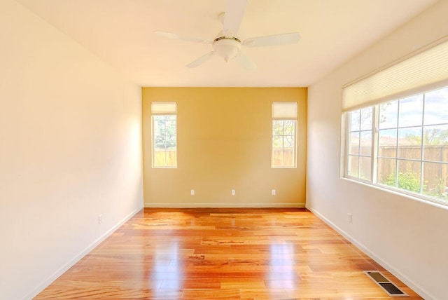 2413 San Remo Dr, Sparks, NV 89434 - unfurnished room featuring light wood-style floors, ceiling fan, and baseboards