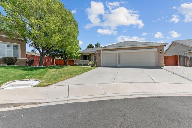 5470 Weatherby Ct, Reno, NV 89523 - view of front of home featuring a garage, concrete driveway, and brick siding