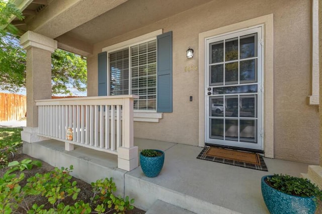 5470 Weatherby Ct, Reno, NV 89523 - property entrance featuring a porch and stucco siding