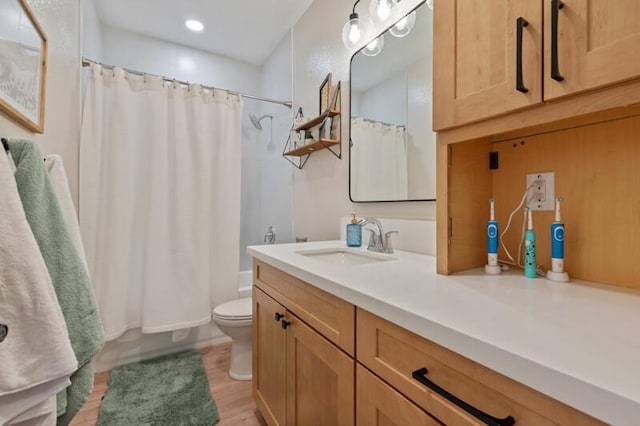 5470 Weatherby Ct, Reno, NV 89523 - full bath with vanity, toilet, wood finished floors, shower / bath combo, and recessed lighting