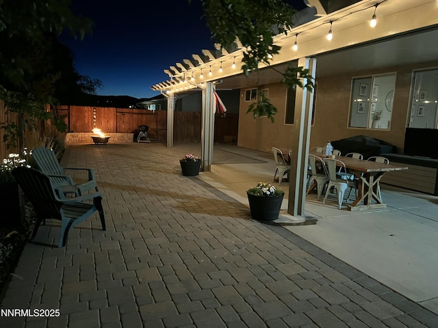 5470 Weatherby Ct, Reno, NV 89523 - fenced backyard with a patio area, outdoor dining area, and a pergola