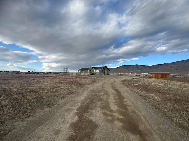 9485 Zaring Ave, Winnemucca, NV 89445 - view of dirt / gravel driveway with a mountain view and a view of rural / pastoral area