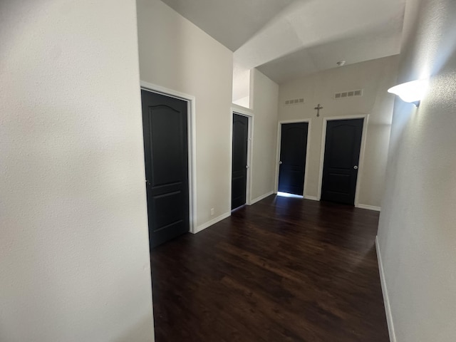 9485 Zaring Ave, Winnemucca, NV 89445 - unfurnished room featuring dark wood finished floors and a high ceiling