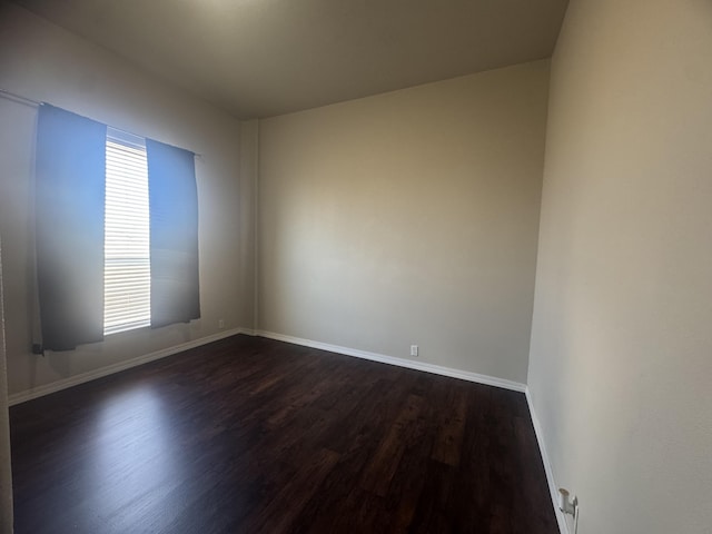 9485 Zaring Ave, Winnemucca, NV 89445 - spare room with dark wood-style flooring and healthy amount of natural light