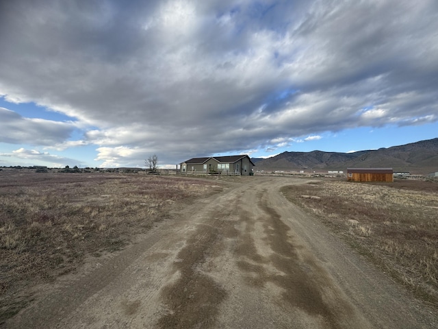 9485 Zaring Ave, Winnemucca, NV 89445 - view of dirt / gravel driveway with a mountain view and a rural view