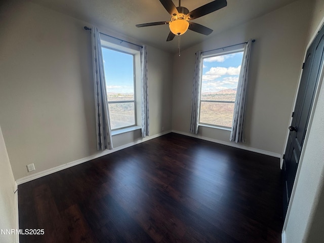 9485 Zaring Ave, Winnemucca, NV 89445 - empty room with dark wood finished floors and ceiling fan