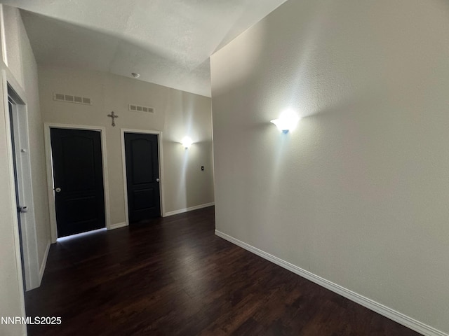 9485 Zaring Ave, Winnemucca, NV 89445 - unfurnished room with dark wood finished floors and baseboards