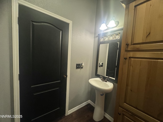 9485 Zaring Ave, Winnemucca, NV 89445 - bathroom with baseboards and wood finished floors