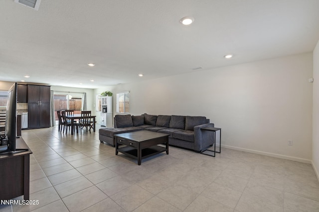 8944 Elk Ravine Dr, Reno, NV 89506 - living area featuring light tile patterned flooring, recessed lighting, and baseboards