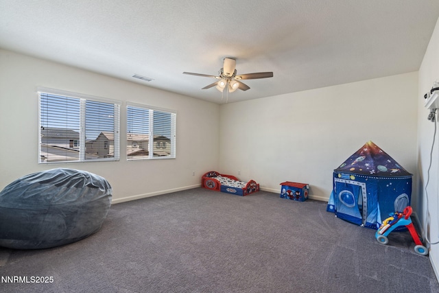 8944 Elk Ravine Dr, Reno, NV 89506 - rec room featuring ceiling fan, carpet, and baseboards