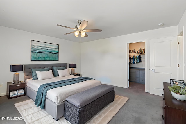 8944 Elk Ravine Dr, Reno, NV 89506 - carpeted bedroom with baseboards, a walk in closet, a closet, and ceiling fan