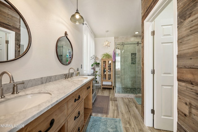 1501 Riverpark Pkwy, Dayton, NV 89403 - full bathroom with a shower stall, double vanity, and wood finished floors