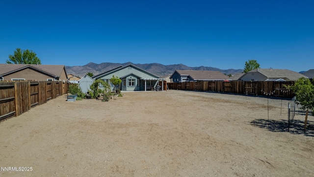 1501 Riverpark Pkwy, Dayton, NV 89403 - fenced backyard with a mountain view