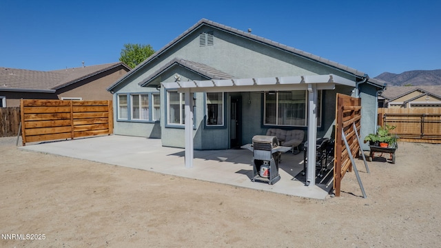 1501 Riverpark Pkwy, Dayton, NV 89403 - rear view of property with a patio, stucco siding, and a fenced backyard