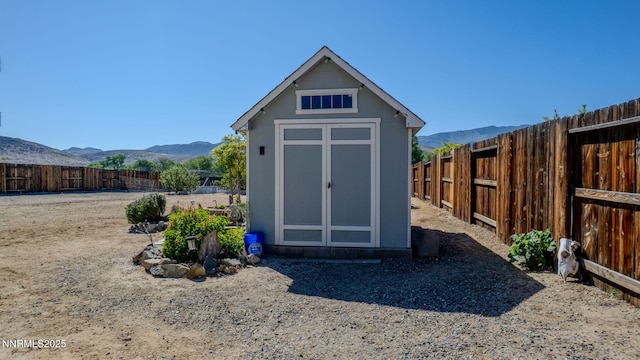 1501 Riverpark Pkwy, Dayton, NV 89403 - view of shed featuring a mountain view and a fenced backyard