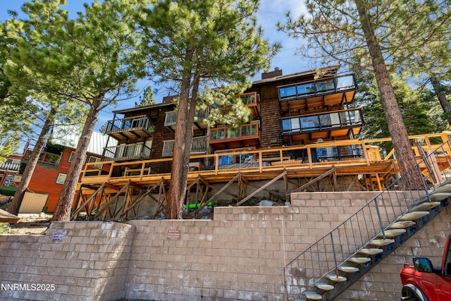 275 Tramway Dr Unit C, Stateline, NV 89449 - rear view of property with a chimney and a deck