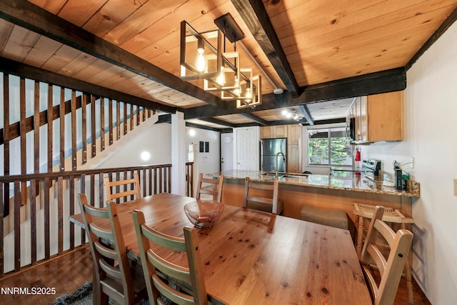 275 Tramway Dr Unit C, Stateline, NV 89449 - dining area with dark wood-style floors, wooden ceiling with exposed beams, and a chandelier