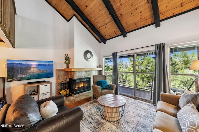 275 Tramway Dr Unit C, Stateline, NV 89449 - living area featuring wooden ceiling with exposed beams, wood finished floors, a tile fireplace, and high vaulted ceiling