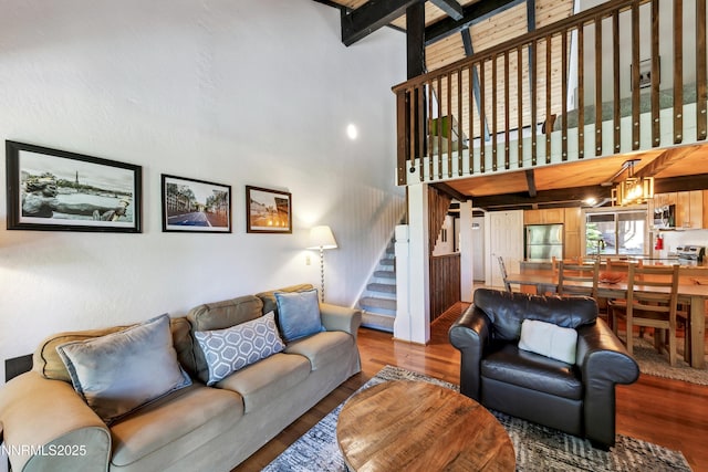 275 Tramway Dr Unit C, Stateline, NV 89449 - living room featuring a towering ceiling, wood finished floors, and stairway