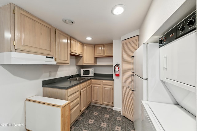 275 Tramway Dr Unit C, Stateline, NV 89449 - kitchen with under cabinet range hood, white appliances, light brown cabinets, a sink, and recessed lighting