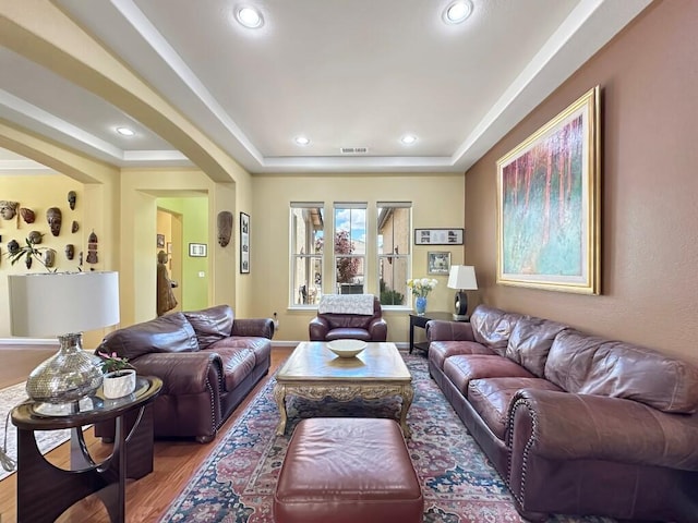 10555 Hampton Creek Dr, Reno, NV 89521 - living area with a tray ceiling, wood finished floors, recessed lighting, and arched walkways